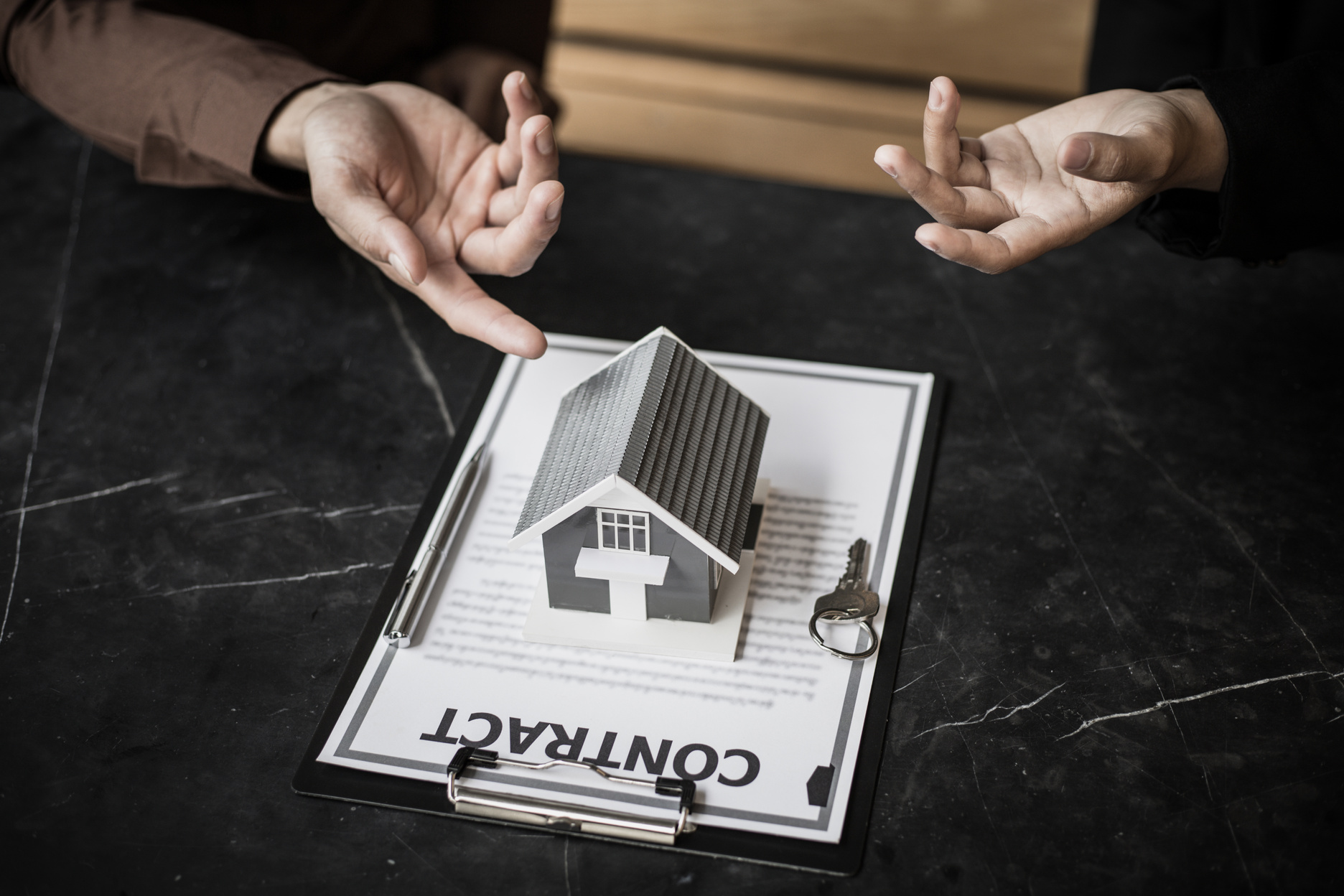 Agent Discussing Real Estate Property Contract Agreement